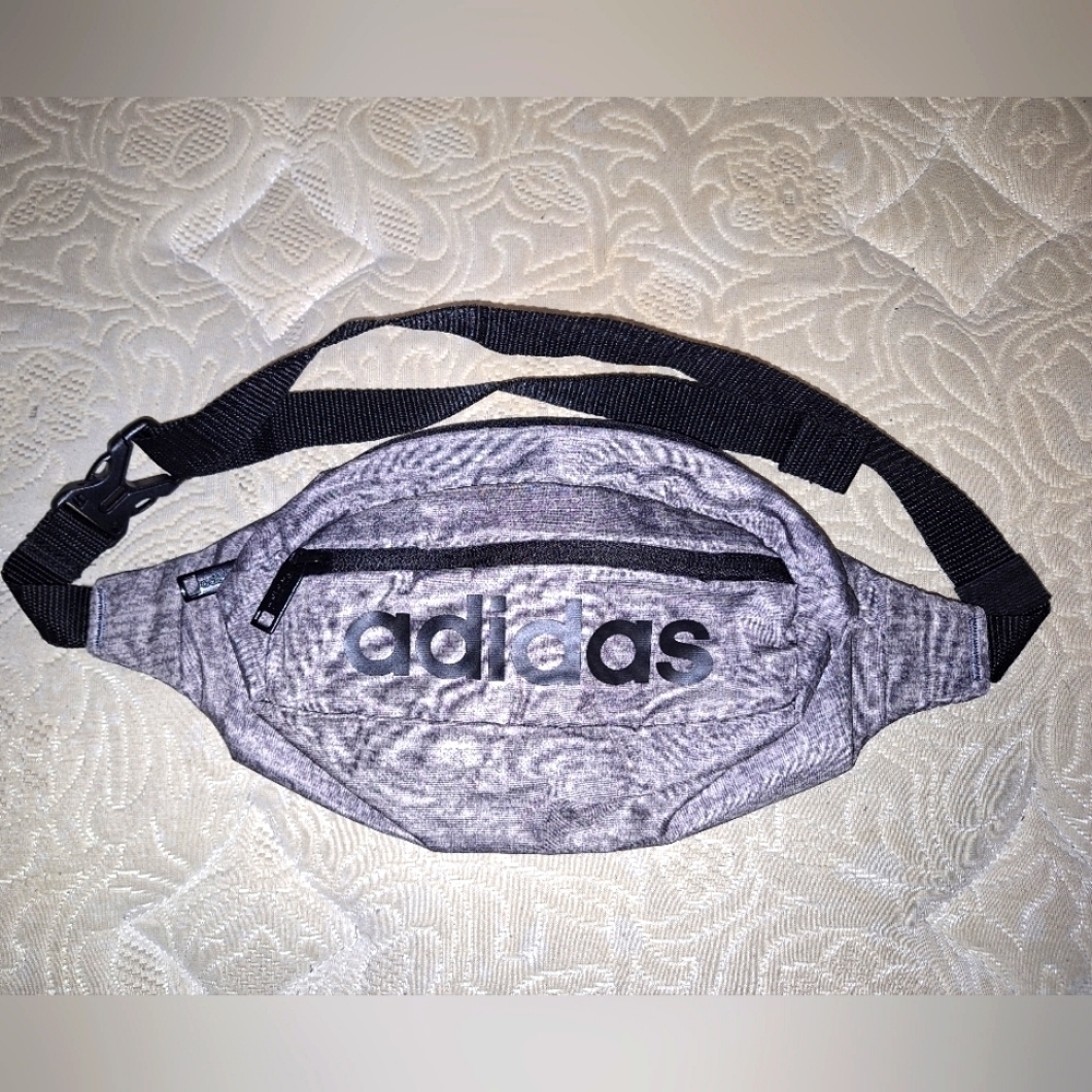 A grey Adidas belt bag. It's in excellent condition.
